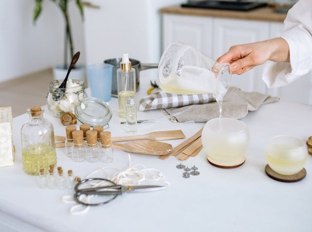 Pouring wax into candle containers